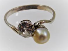 An 18ct & platinum ring set with a pearl & approx.