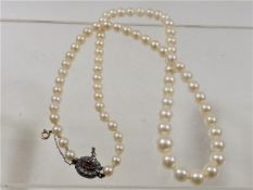 A pearl necklace set with Georgian clasp with diam