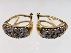A pair of 18ct gold earrings with sprung stud fitt