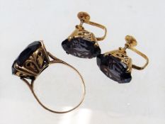 A matching 14ct gold ring & earring set with purpl