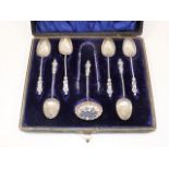 A set of six shell shaped silver spoons twinned wi