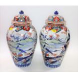 A pair of 19thC. Japanese lidded Imari vases