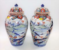 A pair of 19thC. Japanese lidded Imari vases