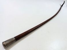 A 19thC. leather riding crop with French silver to