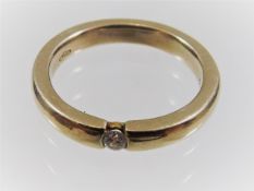 An 18ct gold ring set with diamond