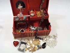 A boxed quantity of costume jewellery