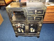 An early 20thC. Chinese lacquered cabinet decorate