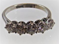 A white metal diamond ring comprising five stones