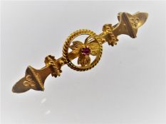 A 15ct gold brooch set with ruby