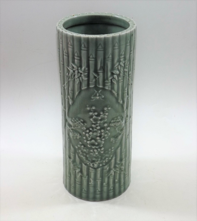 A tall Chinese porcelain celadon brush pot with im