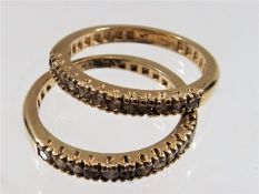 Two matching US 14k gold rings both set with twelv