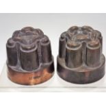 A pair of Victorian copper jelly moulds