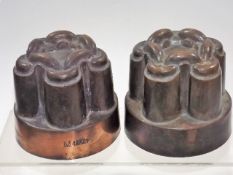 A pair of Victorian copper jelly moulds