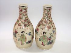 A pair of c.1900 Japanese earthenware vases