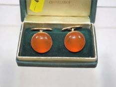 A pair of Russian yellow metal cufflinks set with