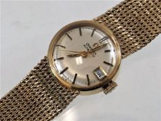 A ladies 9ct gold Omega automatic watch