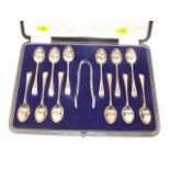 A boxed set of twelve silver teaspoons & tongs