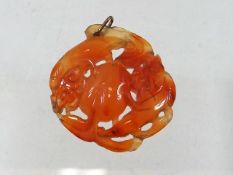 A 19thC. Chinese carved carnelian pendant