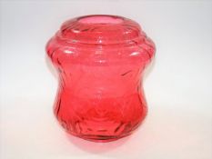 An Edwardian cranberry glass oil lamp shade