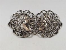 An antique William Comyns silver nurses buckle