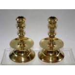 A pair of 19thC. brass candlesticks