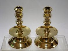 A pair of 19thC. brass candlesticks