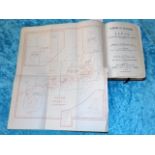 An antique guide to Japan book with fold out maps