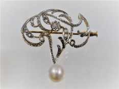 A French art nouveau 18ct gold brooch set with diamonds & pear