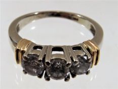 A US three stone art deco style diamond ring in 14