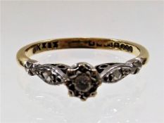 An 18ct gold ring with small diamond