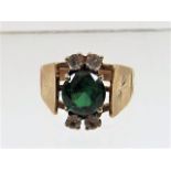 A 9ct gold ring set with green & white stones