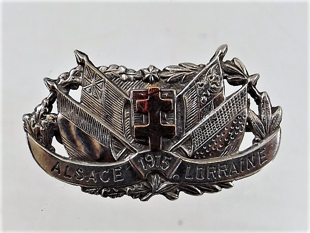 A WW1 silver & yellow metal brooch