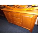 A contemporary oak sideboard with drawers & cupboa