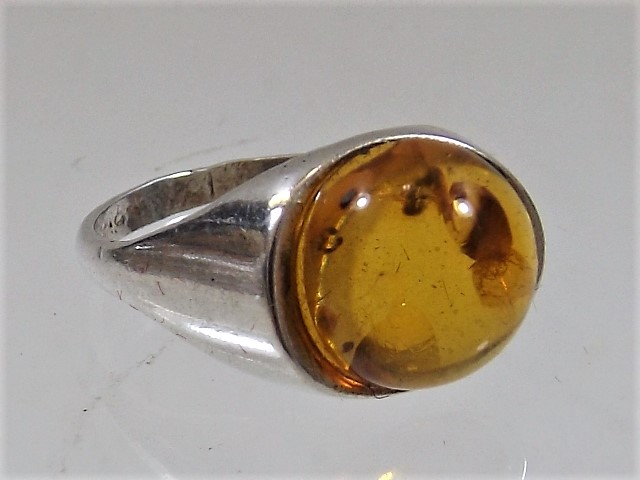A silver & amber ring