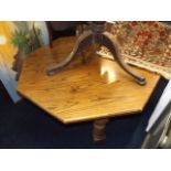 A large octagonal oak coffee table