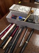 A boxed quantity of pens including fountain pens