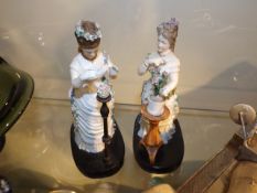 A pair of early 20thC. bisque figures tending to f