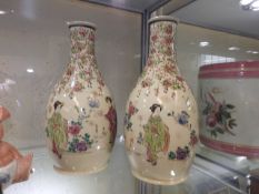 A pair of earthenware Japanese vases