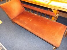 An upholstered chaise longue