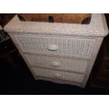 A chest of painted wicker drawers