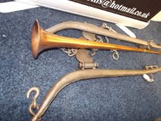 A copper horn & a horse harness & bit