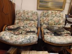 Two 20thC. conservatory armchairs on revolving bas