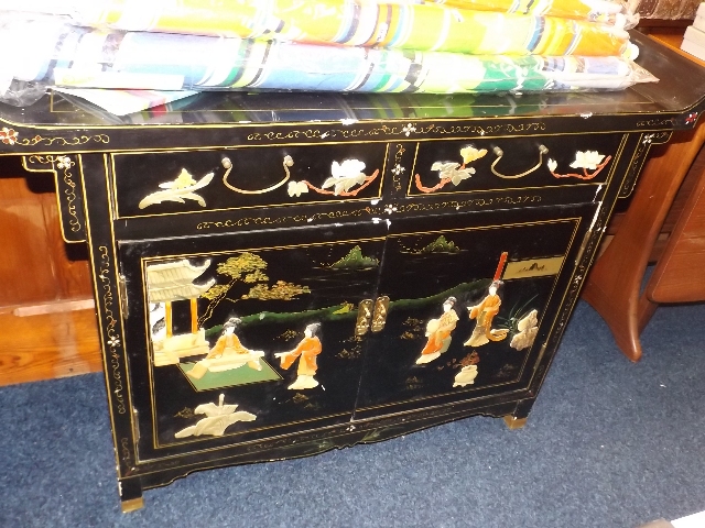 A Chinese side board with applied decor