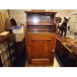 An antique mahogany pot cupboard