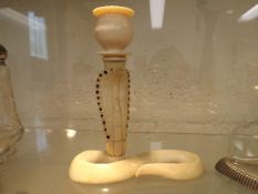 An early 20thC. Indian ivory candle holder
