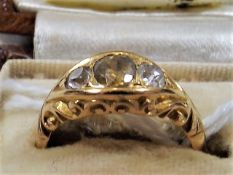 A ladies high carat gold ring set with diamond & c
