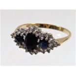 A ladies 9ct gold ring set with diamond & sapphire