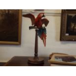 A brass mounted Border Fine Arts parrot