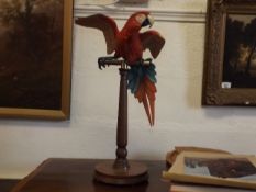 A brass mounted Border Fine Arts parrot