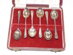 A boxed set of silver teaspoons